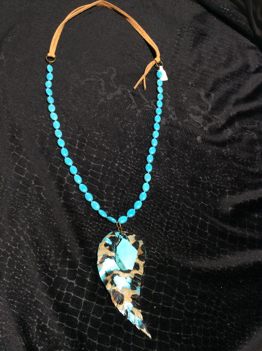 Leather and turquoise necklace with cheetah print feather